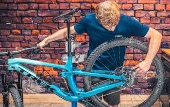 a person servicing a bike